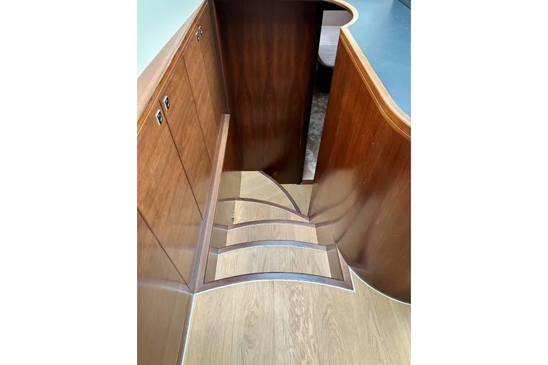  Yacht Photos Pics Wooden interior stairs of Lanzarote 7702, 2025 model, featuring elegant design and craftsmanship.