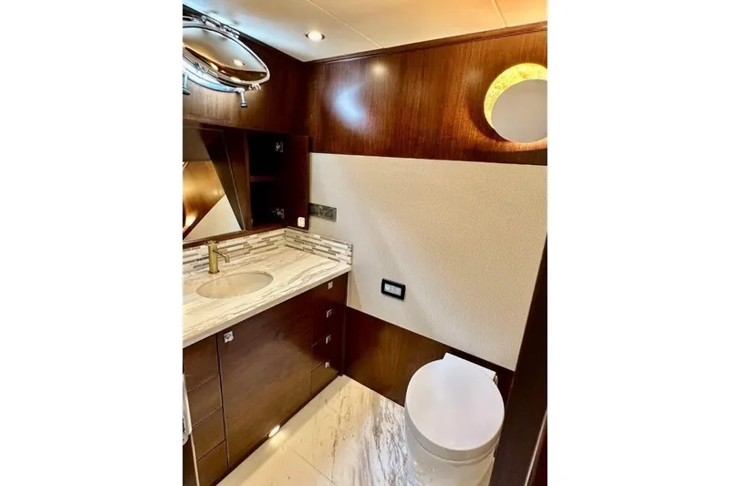  Yacht Photos Pics Luxurious bathroom in 2025 Lanzarote 7702 yacht with elegant wood and marble finishes.