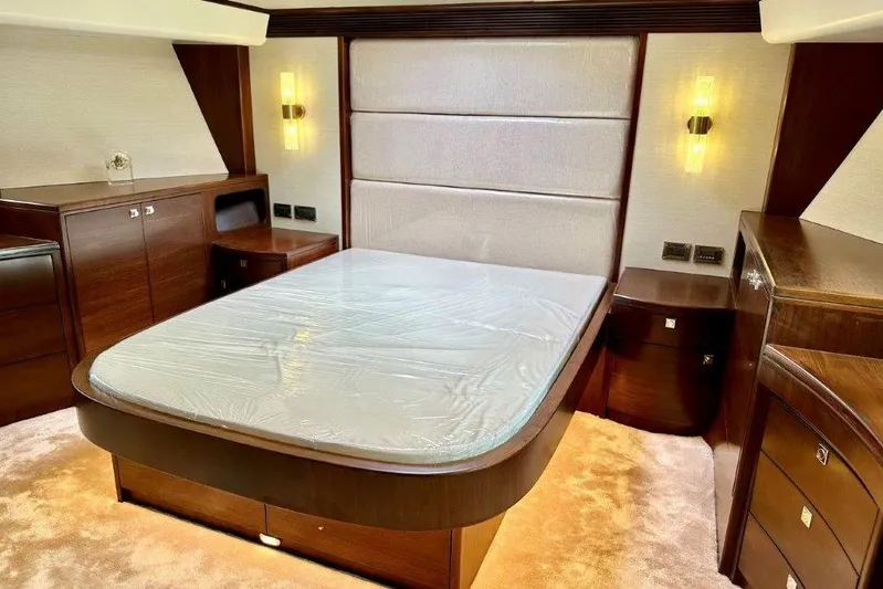  Yacht Photos Pics Luxurious bedroom interior of Lanzarote 7702 yacht, featuring elegant wood finishes, 2025 model.