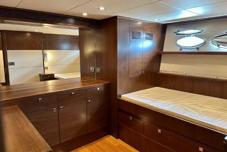  Yacht Photos Pics Luxurious Lanzarote 7702 yacht interior with wooden cabinetry and bed, 2025 model.