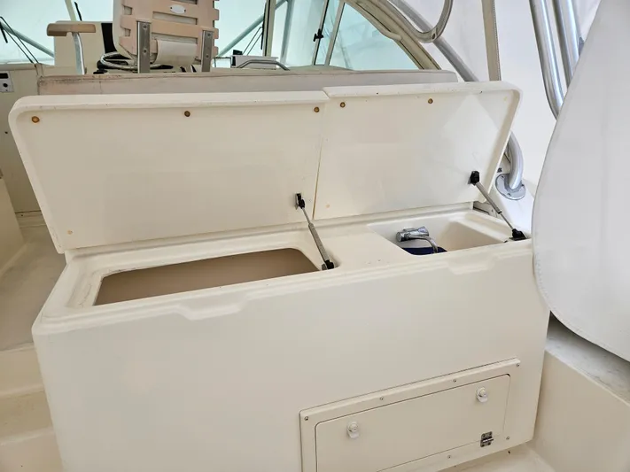  Yacht Photos Pics Open storage compartment on 2008 Albemarle 31 boat, featuring dual sections and a latch.