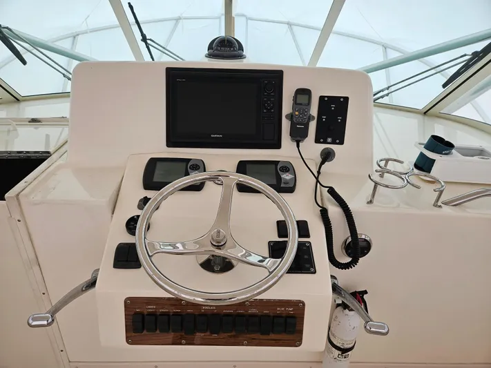  Yacht Photos Pics Helm of 2008 Albemarle 31 boat with steering wheel and navigation equipment.