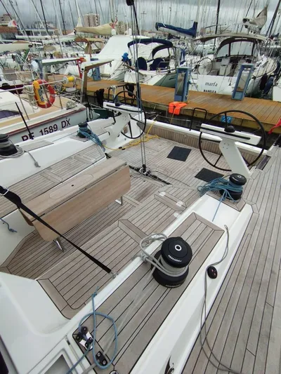 Loic Yacht Photos Pics Italia Yachts 14.98 sailboat deck, 2023 model, docked in a marina.
