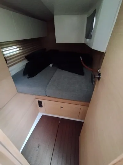 Loic Yacht Photos Pics Cozy cabin interior of 2023 Italia Yachts Italia 14.98 with modern furnishings.