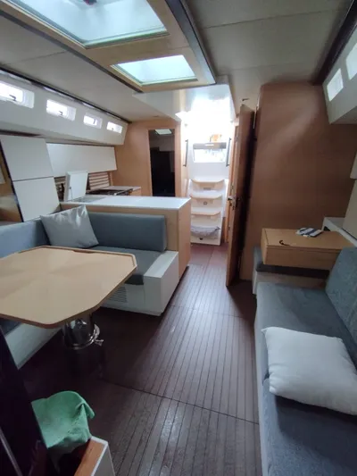 Loic Yacht Photos Pics Luxurious interior of 2023 Italia Yachts Italia 14.98, featuring modern seating and dining area.