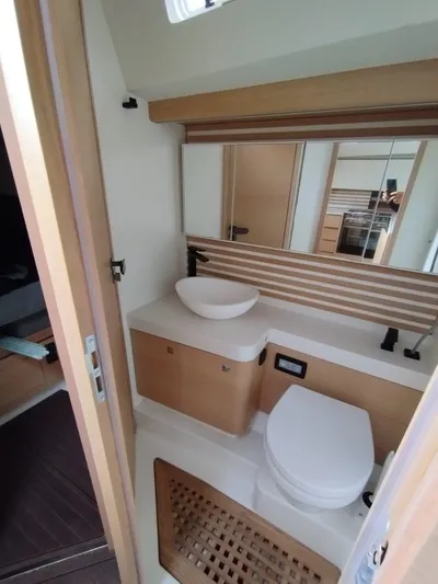 Loic Yacht Photos Pics Modern bathroom interior of 2023 Italia Yachts Italia 14.98, featuring sleek design and fixtures.