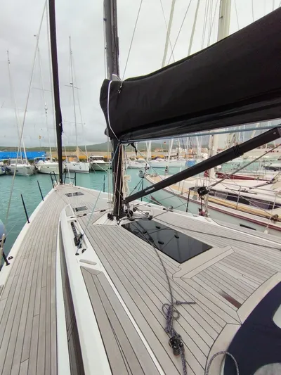 Loic Yacht Photos Pics 2023 Italia Yachts Italia 14.98 sailboat docked in marina, showcasing sleek deck design.