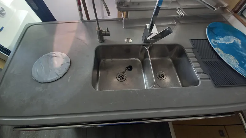 Double Trouble Yacht Photos Pics Modern kitchen sink on 2015 Fountaine Pajot Lipari 41 catamaran, featuring dual basins and sleek design.