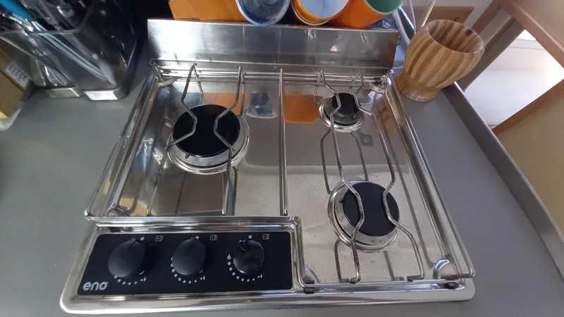 Double Trouble Yacht Photos Pics Stainless steel stove with three burners on a 2015 Fountaine Pajot Lipari 41 yacht.