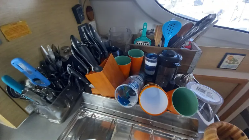 Double Trouble Yacht Photos Pics Kitchen utensils and cups organized on a Fountaine Pajot Lipari 41 catamaran, 2015 model.