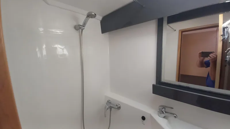 Double Trouble Yacht Photos Pics Bathroom interior of 2015 Fountaine Pajot Lipari 41 catamaran with shower and mirror.