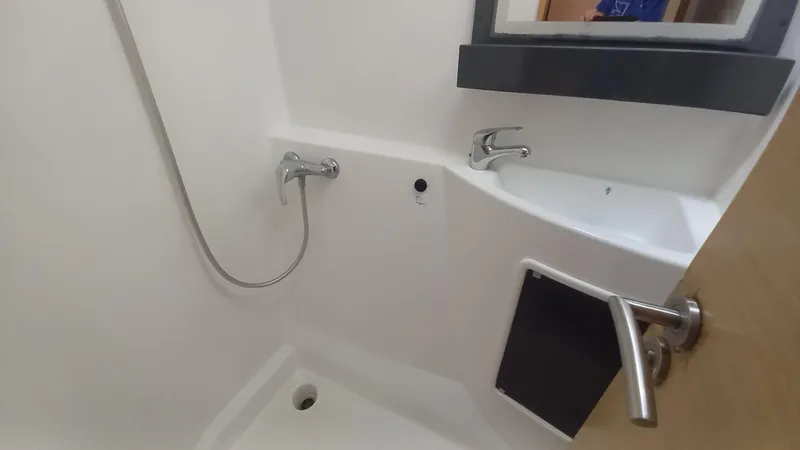 Double Trouble Yacht Photos Pics Bathroom interior of 2015 Fountaine Pajot Lipari 41 catamaran, featuring shower and sink.