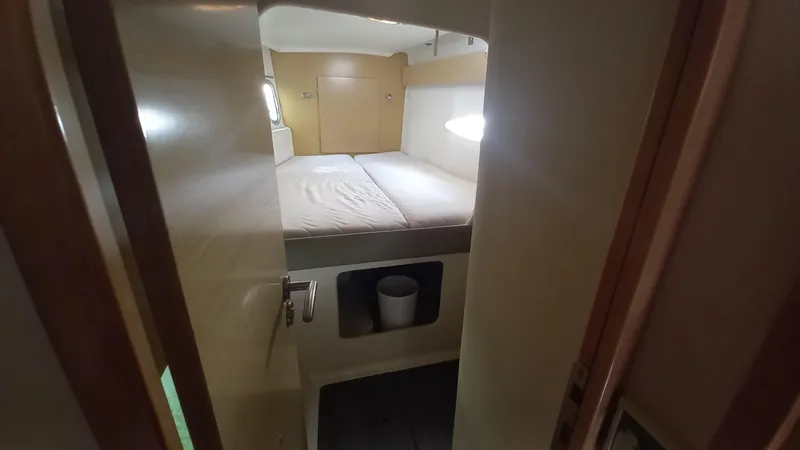 Double Trouble Yacht Photos Pics Cabin interior of 2015 Fountaine Pajot Lipari 41 catamaran, featuring a cozy bed.