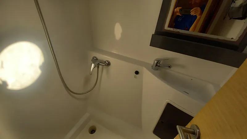 Double Trouble Yacht Photos Pics Interior of 2015 Fountaine Pajot Lipari 41 yacht bathroom with shower and sink.