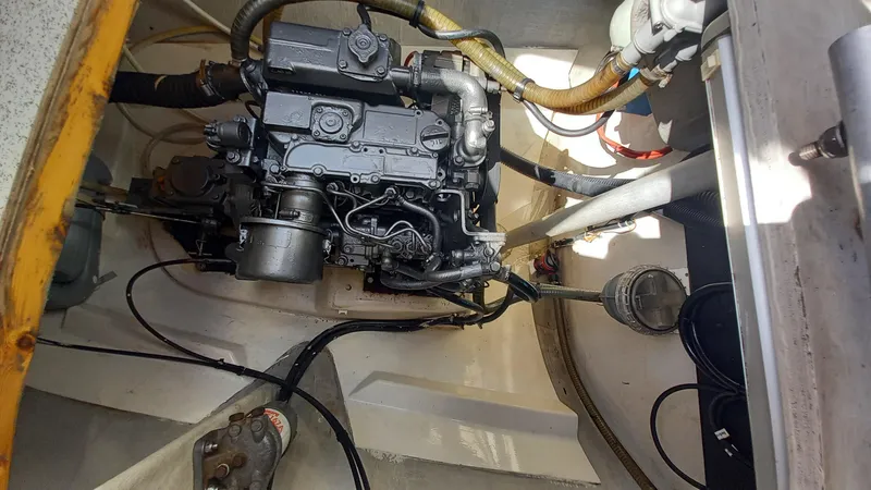 Double Trouble Yacht Photos Pics Engine compartment of a 2015 Fountaine Pajot Lipari 41 catamaran, showcasing mechanical components.