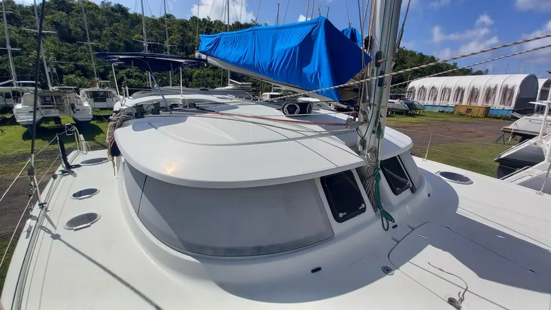 Double Trouble Yacht Photos Pics 2015 Fountaine Pajot Lipari 41 catamaran on land, blue cover, sunny day.