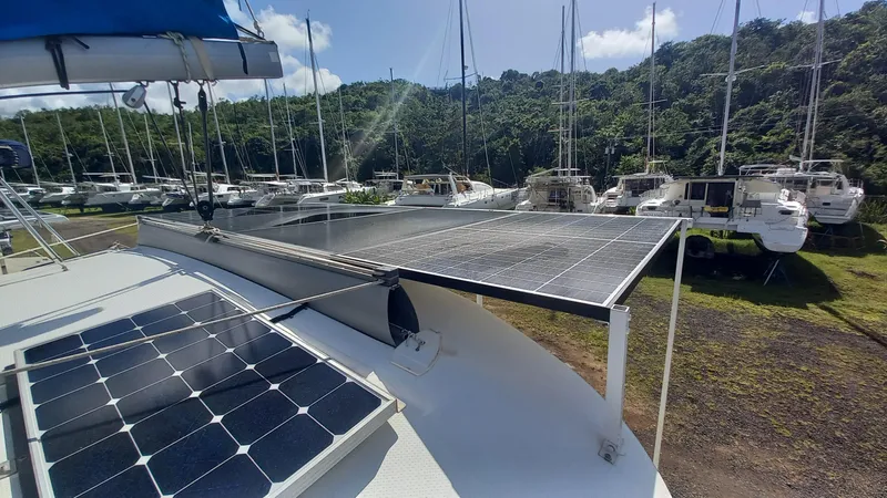 Double Trouble Yacht Photos Pics 2015 Fountaine Pajot Lipari 41 catamaran with solar panels in a marina setting.