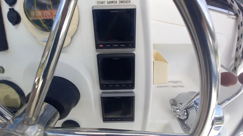 Double Trouble Yacht Photos Pics Control panel of 2015 Fountaine Pajot Lipari 41 with Garmin displays and steering wheel.