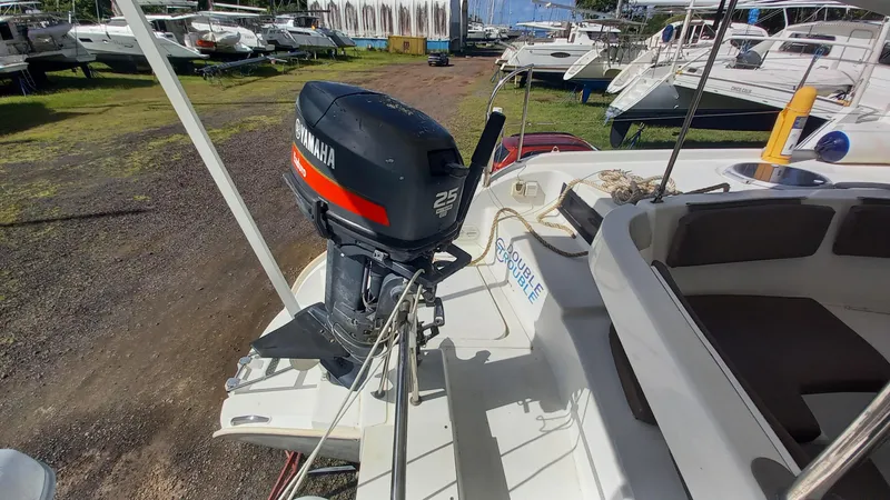 Double Trouble Yacht Photos Pics 2015 Fountaine Pajot Lipari 41 catamaran with Yamaha 25 outboard motor in a marina.