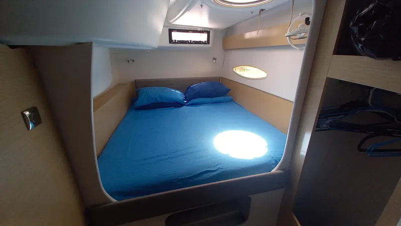 Double Trouble Yacht Photos Pics Cozy cabin interior of 2015 Fountaine Pajot Lipari 41 catamaran with blue bedding.
