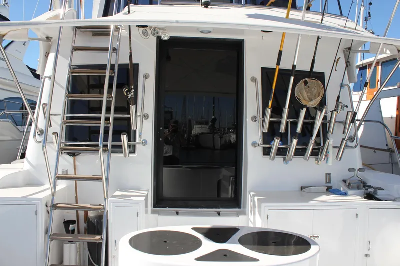 Ocean Eyes Yacht Photos Pics 1994 Mikelson 64 yacht stern with fishing rods and ladder.