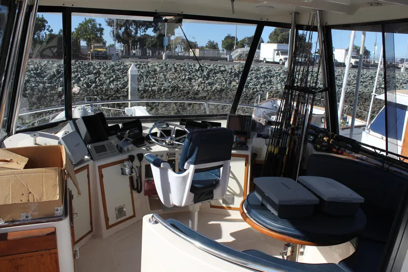 Ocean Eyes Yacht Photos Pics Interior view of a 1994 Mikelson 64 yacht cockpit with navigation equipment.