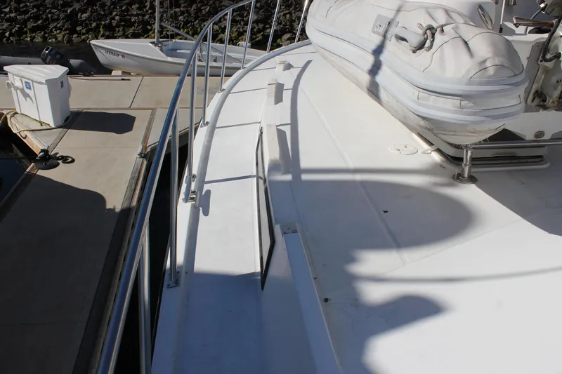 Ocean Eyes Yacht Photos Pics 1994 Mikelson 64 yacht deck with railing and inflatable boat.