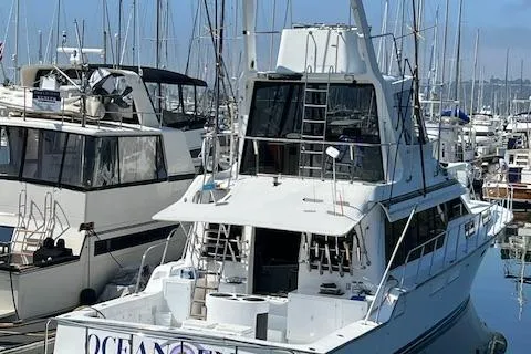 Ocean Eyes Yacht Photos Pics 1994 Mikelson 64 yacht docked in a marina, surrounded by other boats.