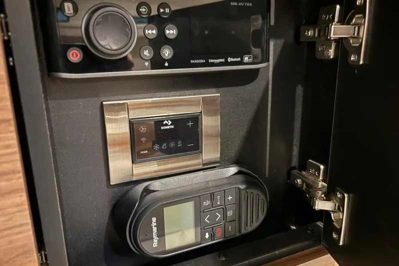  Yacht Photos Pics Control panel inside a 2022 Boston Whaler 325 Conquest boat, featuring Dometic and Raymarine devices.