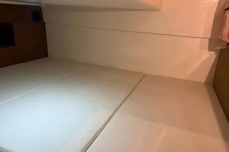  Yacht Photos Pics Interior cabin of 2022 Boston Whaler 325 Conquest with white cushioned seating.