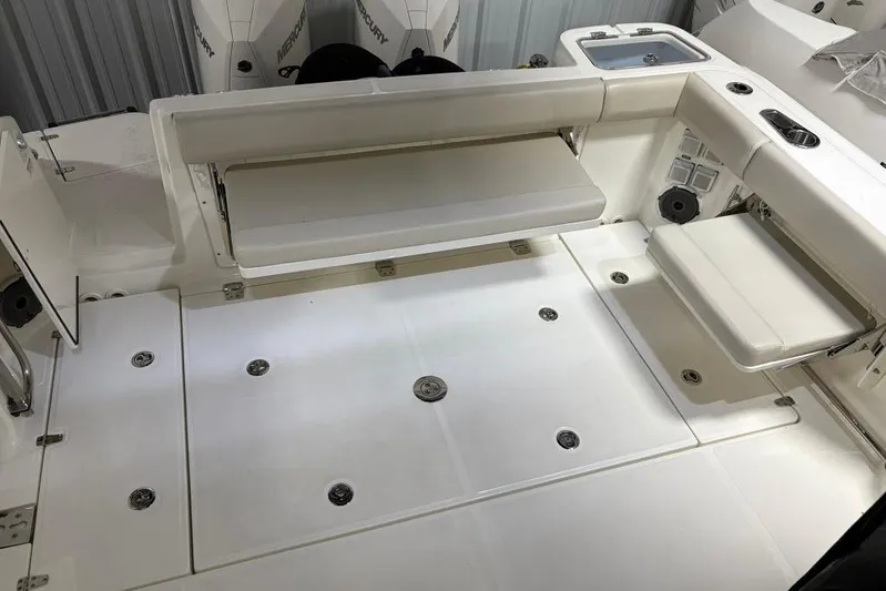  Yacht Photos Pics 2022 Boston Whaler 325 Conquest boat deck with seating and storage compartments.
