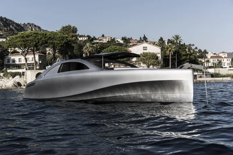 Mercedes Yacht Photos Pics 2022 Silver Arrows Marine Arrow 460 GT yacht on water, with scenic coastal backdrop.