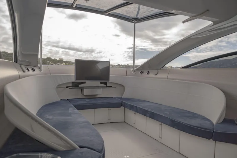 Mercedes Yacht Photos Pics Luxurious interior of 2022 Silver Arrows Marine Arrow 460 GT yacht with modern seating and TV.