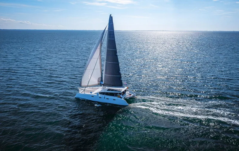 Yacht Photos Pics Ocean Renegade R5 MKII 2025 catamaran sailing on open sea under clear blue sky.