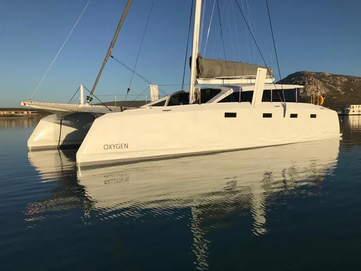  Yacht Photos Pics Ocean Renegade R5 MKII 2025 catamaran Oxygen docked in calm waters.