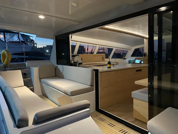  Yacht Photos Pics Modern interior of Ocean Renegade R5 MKII 2025 catamaran at sunset.