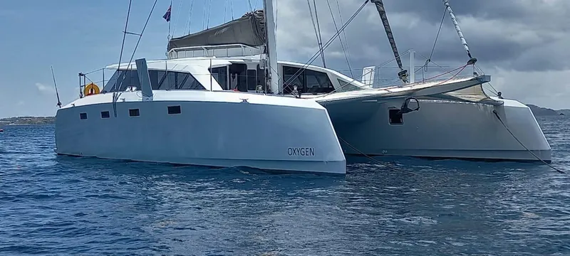  Yacht Photos Pics Ocean Renegade R5 MKII 2025 catamaran sailing on calm blue waters.