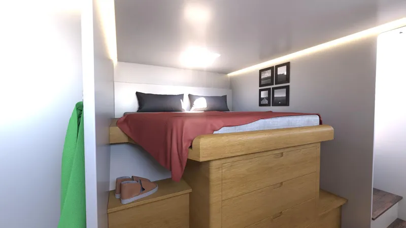  Yacht Photos Pics Cozy bedroom in 2025 Ocean Renegade R5 MKII with elevated bed and modern decor.