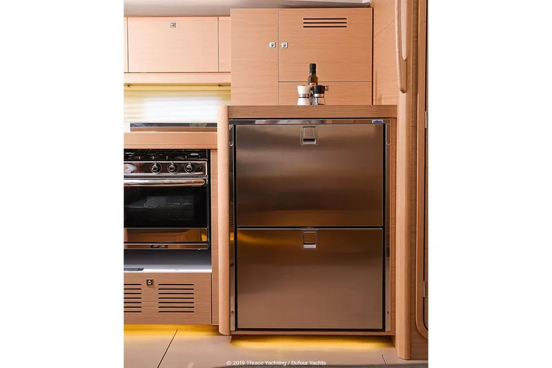  Yacht Photos Pics Modern kitchen interior of 2019 Dufour 460 Grand Large yacht with stainless steel appliances.