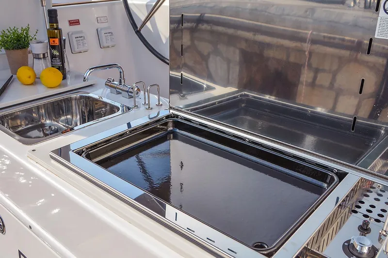  Yacht Photos Pics Outdoor kitchen on 2019 Dufour 460 Grand Large yacht with sink and grill.