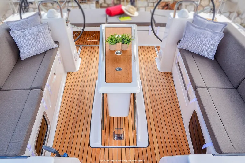  Yacht Photos Pics Luxurious 2019 Dufour 460 Grand Large yacht cockpit with elegant seating and wooden flooring.