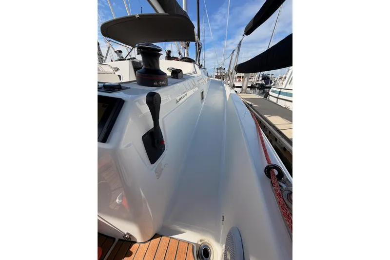 C'est Chic Yacht Photos Pics 2025 Jeanneau Sun Odyssey 350 sailboat deck with winch and control lever.