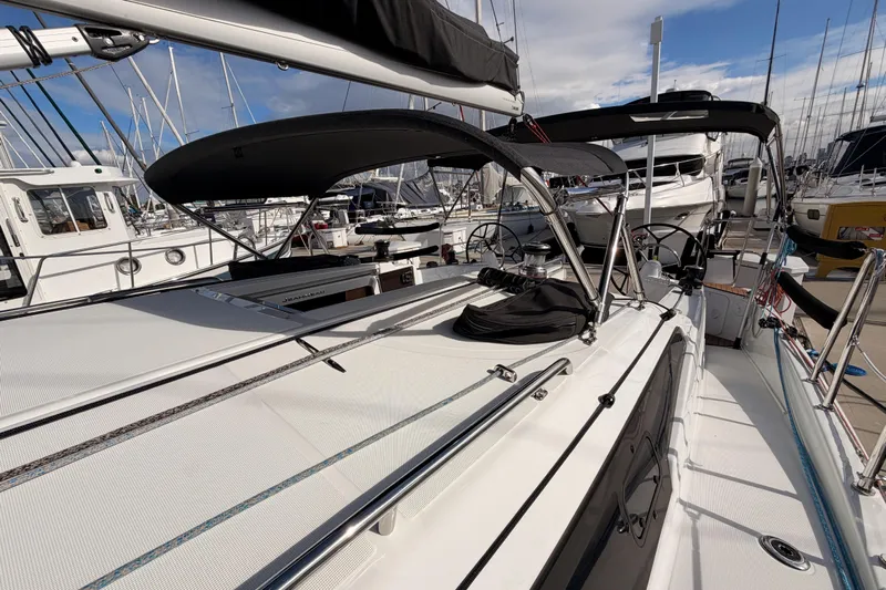 C'est Chic Yacht Photos Pics 2025 Jeanneau Sun Odyssey 350 sailboat docked, showcasing sleek design and modern features.