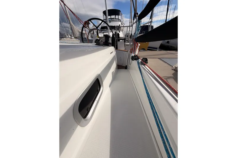C'est Chic Yacht Photos Pics 2025 Jeanneau Sun Odyssey 350 sailboat deck with ropes and steering wheel.