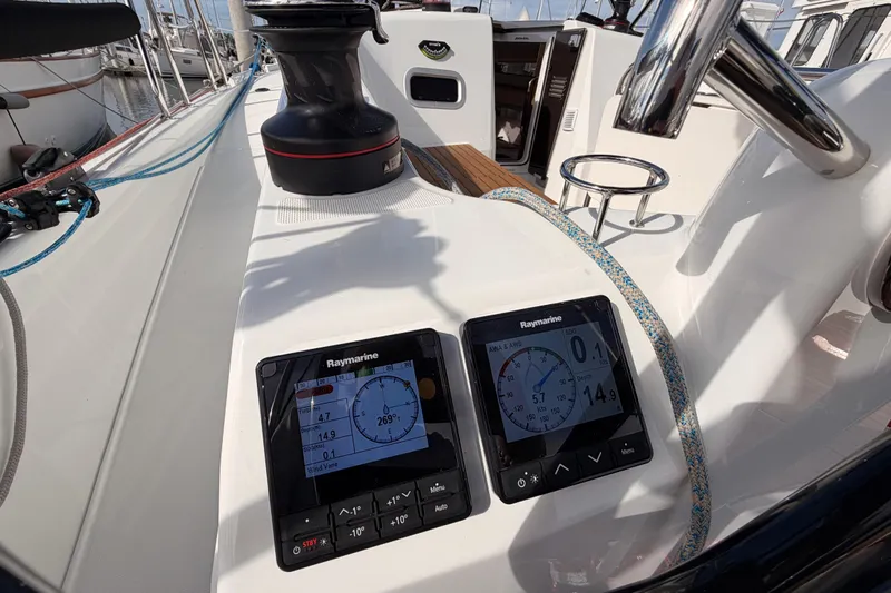 C'est Chic Yacht Photos Pics 2025 Jeanneau Sun Odyssey 350 cockpit with Raymarine navigation displays and winch.