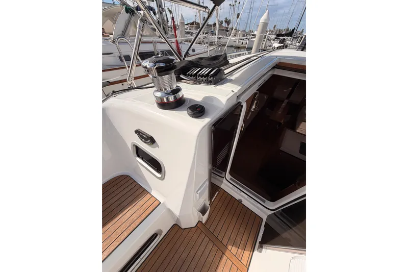 C'est Chic Yacht Photos Pics 2025 Jeanneau Sun Odyssey 350 yacht deck with winch and teak flooring.