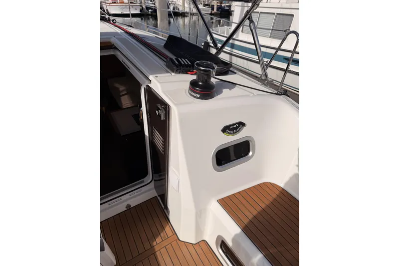 C'est Chic Yacht Photos Pics 2025 Jeanneau Sun Odyssey 350 yacht deck with winch and teak flooring.