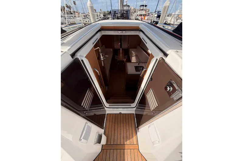 C'est Chic Yacht Photos Pics 2025 Jeanneau Sun Odyssey 350 yacht interior view with open cabin doors.