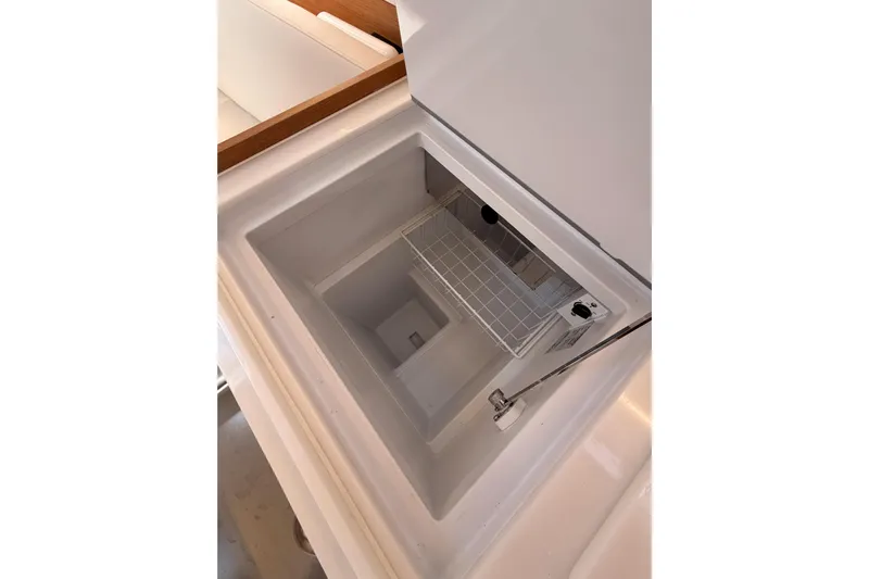 C'est Chic Yacht Photos Pics Interior view of Jeanneau Sun Odyssey 350 yacht's built-in storage compartment, 2025 model.