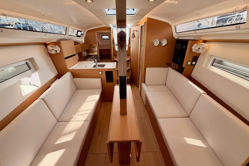 C'est Chic Yacht Photos Pics Interior of 2025 Jeanneau Sun Odyssey 350 yacht, featuring modern design and comfortable seating.